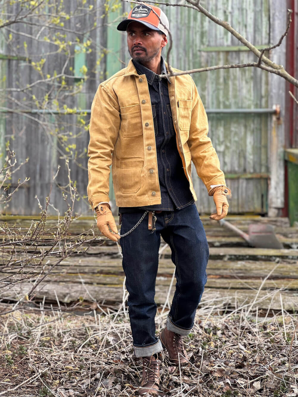 Front view of custom-made sand canvas chore jacket with metal buttons.