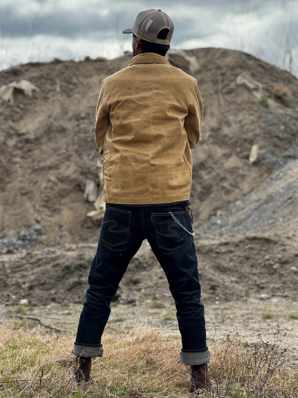 Back view of custom-made sand canvas chore jacket with metal buttons.